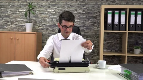 The writer does not know what to write on a typewriter Stock Footage 115790872