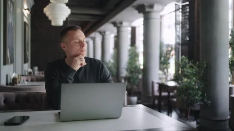 Writer Or Journalist Man Working Online With Laptop In Cafe In Daytime, Portrait Stock Footage 247734548