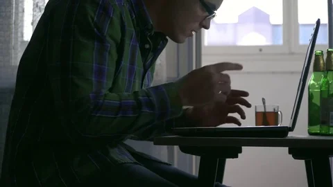 A writer or a programmer works at home for a laptop not for the first day. On Stock Footage 81901074