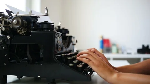 Writer prints on retro typing machine Stock Footage 94584041