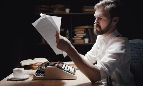 Writer reading typescript Stock Photos