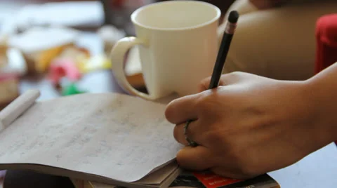 Writer Scribbling on Note Pad Stock Footage 37923624