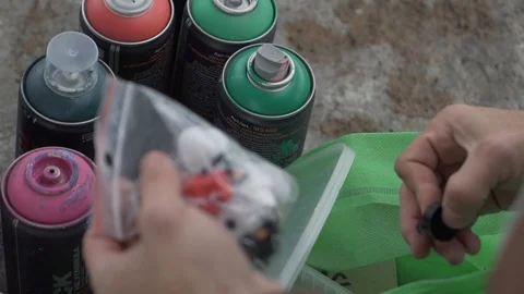 Writer with spray paint cans 2 Stock Footage 122147221