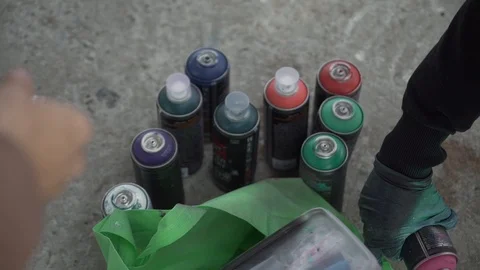 Writer with spray paint cans Stock Footage 122146469