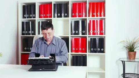 Writer typing on an old typewriter in the office Stock Footage 61535551