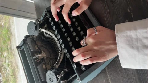 Writer typing with retro writing machine. View from above. Vertical 4k footage Stock Footage 246145526