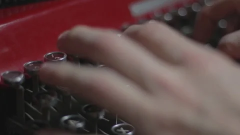 Writer Typing on Vintage Red Typewriter in tight close up Stock Footage 86499475