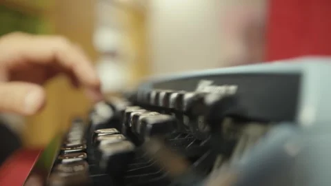 Writer typing on a vintage typewriter Stock Footage 306462922