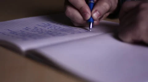 Writer Writing Song in Notebook Stock Footage