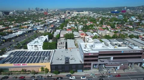 Writers guild drone traders joe in front of the grove drone Stock Footage 63356576