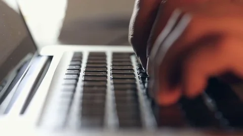 Writer's hands typing on a laptop keypad Video stock 80675198