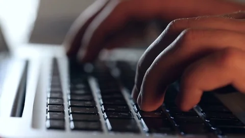Writer's hands typing on a laptop keypad Video stock 80675205