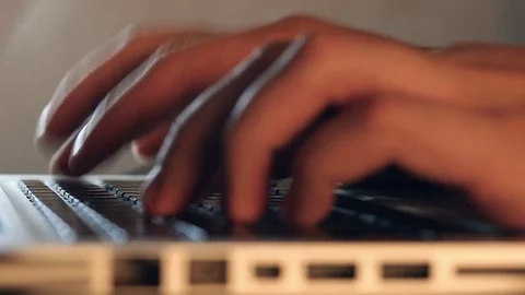 Writer's hands typing on a laptop keypad Video stock 80675238