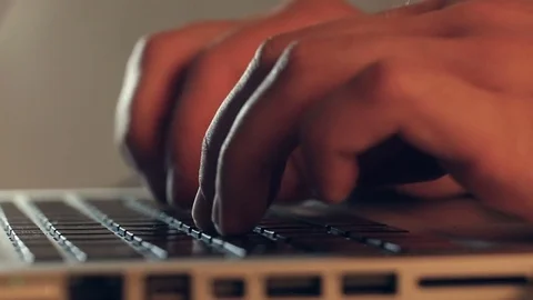 Writer's hands typing on a laptop keypad Video stock 80675250