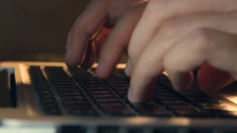 Writer's hands typing on a laptop keypad Video stock 80675273