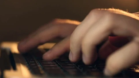 Writer's hands typing on a laptop keypad Video stock 80675324