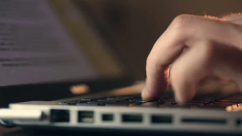 Writer's hands typing on a laptop keypad Video stock 80675334