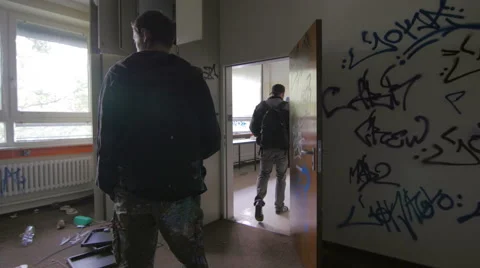 Writers walking in an abandoned building Stock Footage 58632090