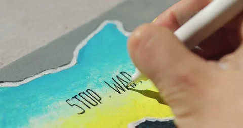 Writes with a black marker stop the war on the drawing of the map of ukraine Video stock 172037181