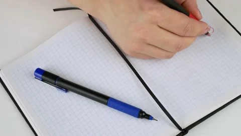 Writes by hand in a notebook.Freedom of speech-lettering in English. Stock-Footage 141100637