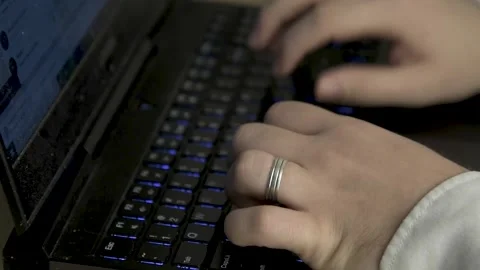 Writes on a keyboard Stock Footage 153029429