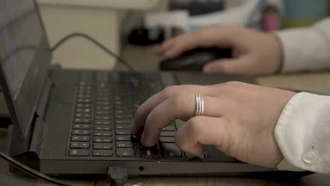 Writes on a keyboard Stock Footage 153029438