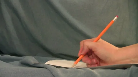 Writes number 2 pencil blank paper erases eraser blue background Stock Footage 35533260
