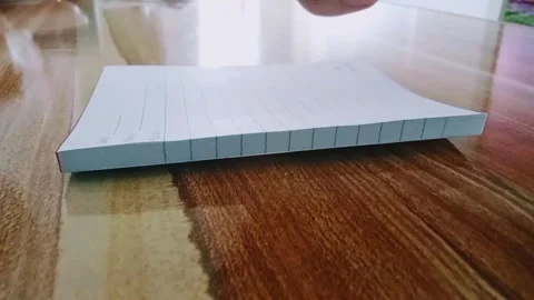 Writes with a pen in a notebook Stock Footage 323388789