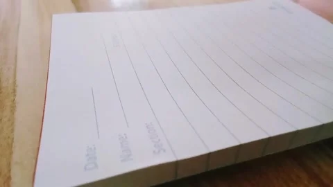 Writes with a pen in a notebook Stock Footage 323388792