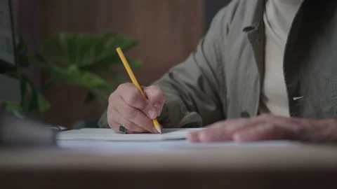 Writes with a pencil, project development, idea creation Stock Footage 137232511