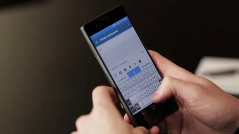 Writes sms on the smartphone Stock Footage 72984871