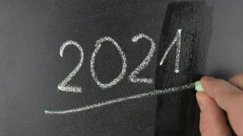 Writing 2021 Year instead of 2020 with Chalk on Blackboard Stock Footage 147608538