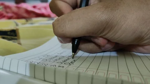 Writing activity in a book Stock Footage 304341752