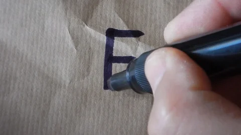 Writing the alphabet letter E Stock Footage 105851975