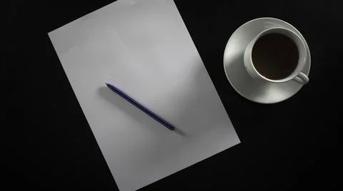 Writing and drinking filter coffee in white cup and coaster Stock-Fotos