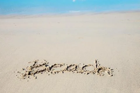 Writing beach on sand. Stock Photos