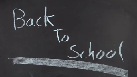 Writing on the blackboard, back to school. Stock Footage 84037246