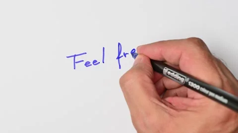 Writing with a blue marker the sentence: Feel free Stock Footage 221782748