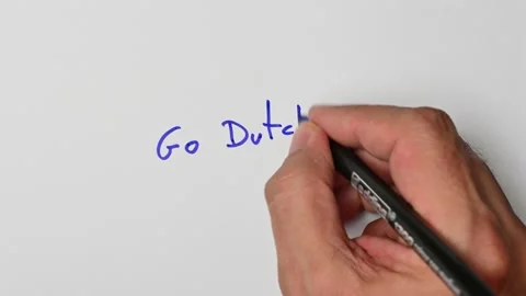 Writing with a blue marker the sentence: Go Dutch Stock Footage 221783685