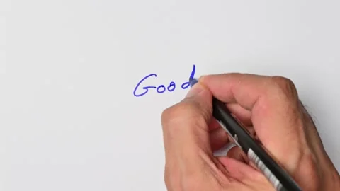 Writing with a blue marker the sentence: Good Stock Footage 221780705