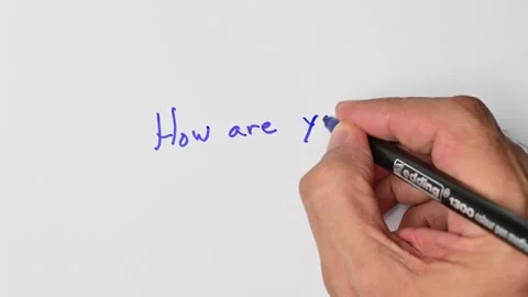 Writing with a blue marker the sentence: How are you? Stock Footage 221780839