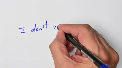 Writing with a blue marker the sentence: I don’t understand Stock Footage 221780858