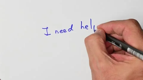 Writing with a blue marker the sentence: I need help Stock Footage 221781051