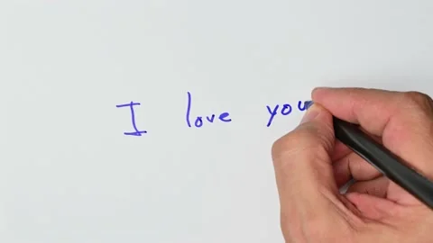 Writing with a blue marker the sentence: I love you Stock Footage 221781233