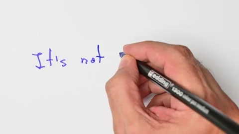 Writing with a blue marker the sentence: It’s not my business Stock Footage 221782257