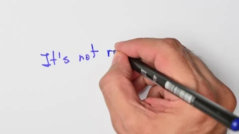 Writing with a blue marker the sentence: It’s not rocket science Stock Footage 221782811