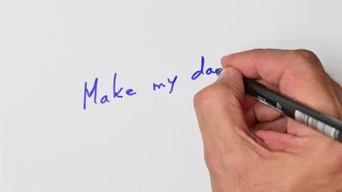 Writing with a blue marker the sentence: Make my day Stock Footage 221782029