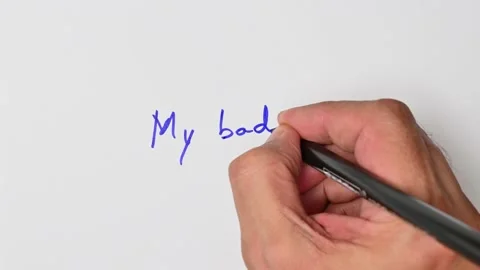 Writing with a blue marker the sentence: My bad Stock Footage 221781963