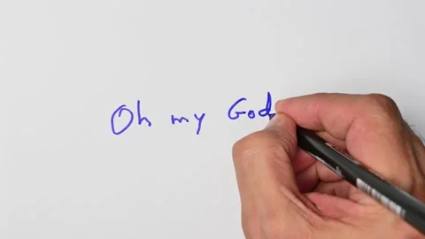 Writing with a blue marker the sentence: Oh my God! Stock Footage 221781855