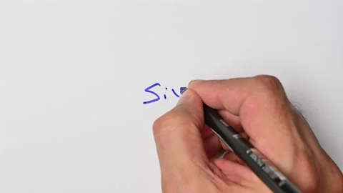 Writing with a blue marker the sentence: Six Stock Footage 221783960